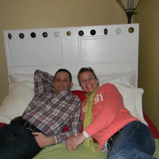 Mariette + John Fredericks Comfy Bedroom #4 - love the headboard: Door on its side with fabulous, antique door knobs at top.