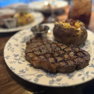 Ribeye with loaded baked potato