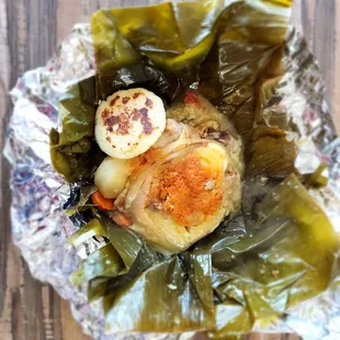 a plate of food wrapped in foil