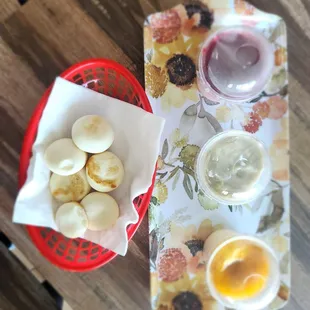 a plate of food and a bowl of fruit