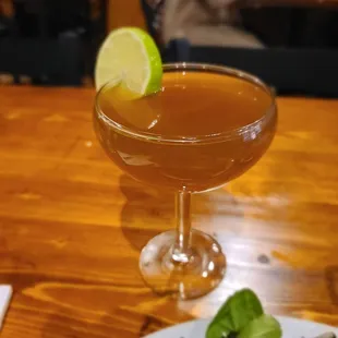 a plate of salad and a cocktail