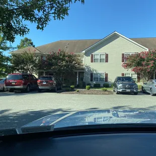 3 spots for 4 units. The bushes and bark chips should be turned into parking spots, to actually match room count.