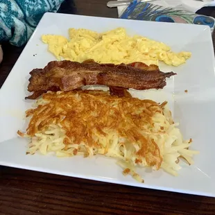 2 Eggs scrambled with crispy bacon and hash browns