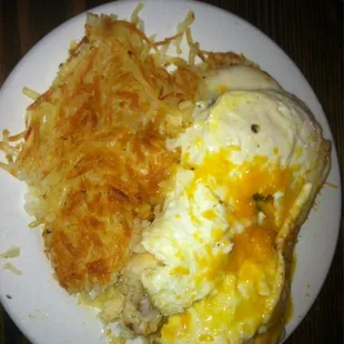Bisquit breakfast... Includes. 2 over easy eggs &amp; cheese on a gravy covered bisquit with hashbrowns on side.
