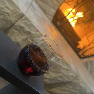 a glass of wine on a table