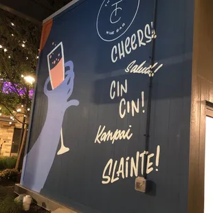 a hand holding a wine glass