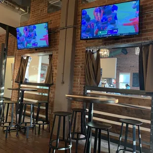 Lots of TVs and seating.