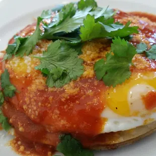 Breakfast quesadilla stack- four tortillas layered with cheddar,  2 sunny side up eggs, spicy tomato sauce, &amp; cilantro. Nice!