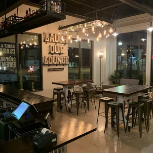 a bar with tables and stools