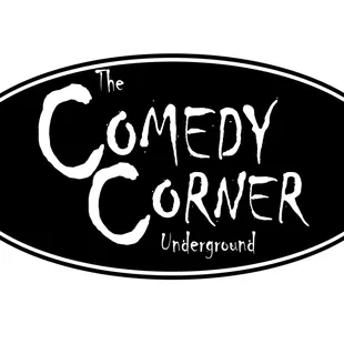 a black oval sign with the words comedy corner underneath it