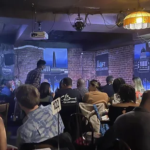 a crowd of people sitting at tables