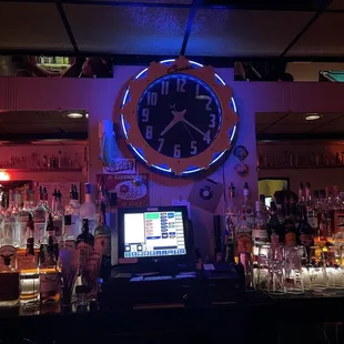 a bar with a clock on the wall