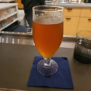 a glass of beer on a table