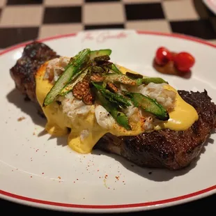 Whiskey strip Oscar style. Never had fried caperberries before, very interesting.