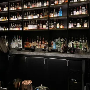 a woman standing at a bar