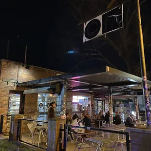 people sitting outside at night