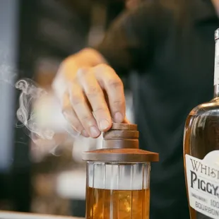 a person preparing a drink