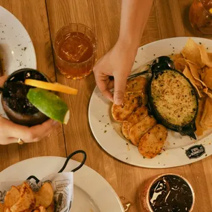 people eating and drinking at a restaurant