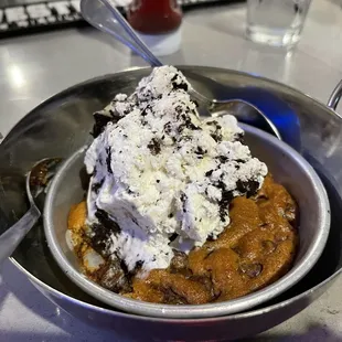 Warm chocolate chip cookie with Oreo ice cream.
