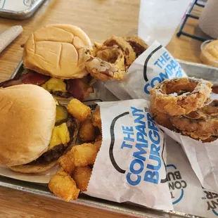 two burgers and onion rings