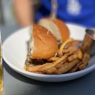 a plate of food and a glass of beer