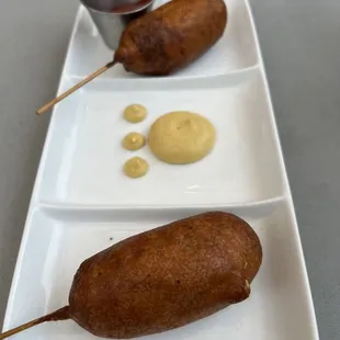 Two corn dogs