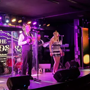 a man and a woman on stage