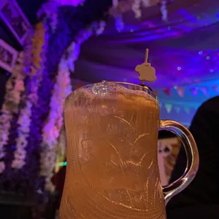 a glass of iced tea on a table