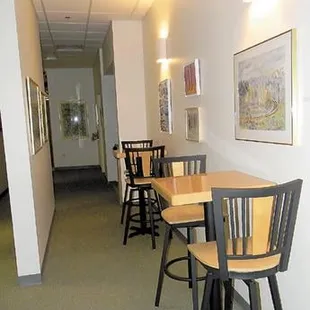 a row of bar stools in a hallway