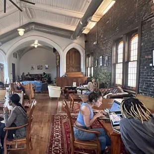 Such beautiful hard wood floors and exposed bricks