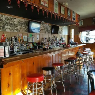 19 chairs at the counter. Booths and tables can accommodate setting for 32 more.