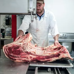 a man in a butcher's kitchen