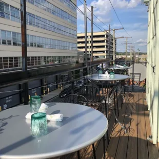 tables and chairs on the balcony