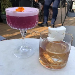two cocktails on a table