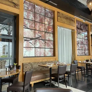 a dining area with tables and chairs