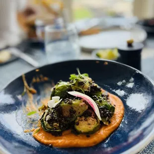 Brussel sprout salad with lentil hummus, and an ocean view