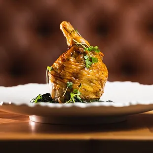 Roasted Chicken - half deboned chicken, sautéed spinach, chicken jus