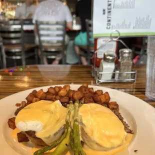 beef brisket benedict, sauteed onions &amp; mushrooms, poached eggs, popovers, asparagus, horseradish chive hollandaise, home fri