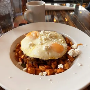 Brunch lamb w/ potatoes, goat cheese, kale, and 2 fried eggs