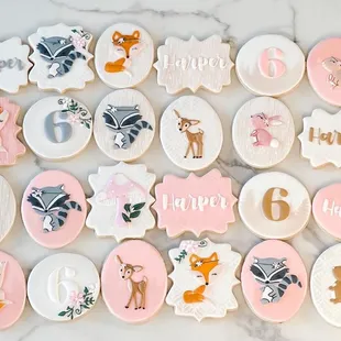 a number of decorated cookies