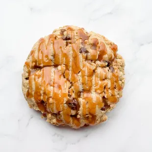 a cookie with caramel drizzle