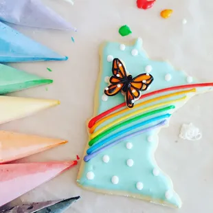 a decorated cookie with a butterfly on it