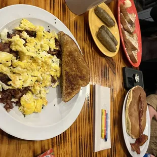 Hash &amp; Eggs, French Toast with Sausage, and a pancake stack with Bacon.