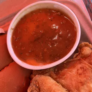 a bowl of soup, hot dogs, and bread