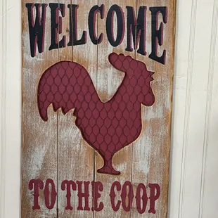 a welcome sign with a rooster on it