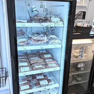a display case with a variety of food items