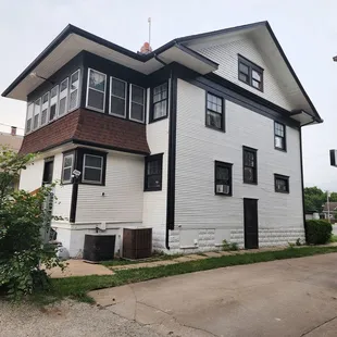 A freestanding 2 story house,  across from Kwik Shop on Douglas.