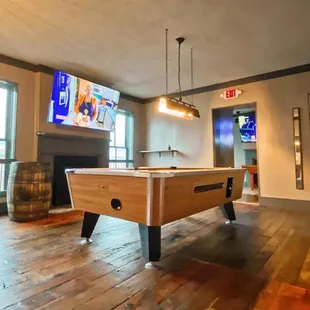 a pool table in the foreground
