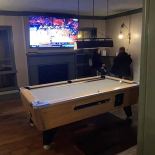 Pool tables and TVs upstairs