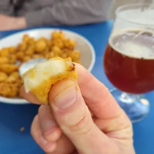 a person holding a piece of food